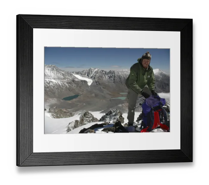 Framed Print : Mountaineer with his backpack on a peak with a view into the mountain scenery of Turgen Uul Kharkhiraa Mongolian Altai Framed Print : Mountaineer with his backpack on a peak with a view into the mountain scenery of Turgen Uul Kharkhiraa Mongolian Altai