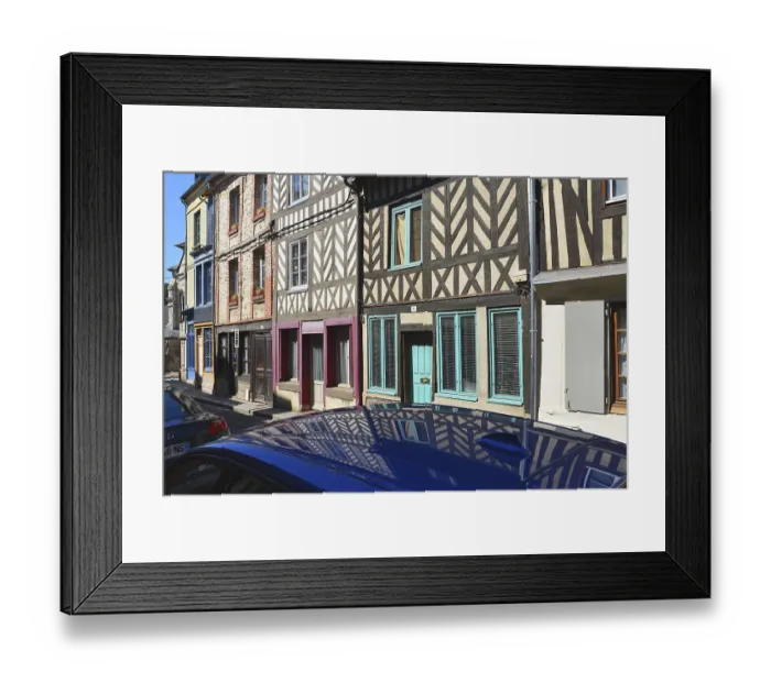 Framed Print : Half-timbered houses are reflected on the roof of a car Framed Print : Half-timbered houses are reflected on the roof of a car