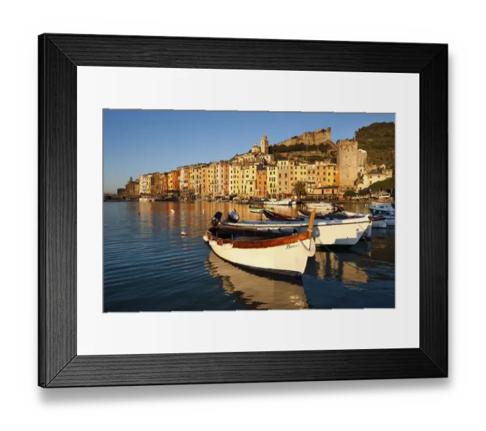 Framed Print : Fishing boats in the harbour in front of the historic town centre of Porto Venere