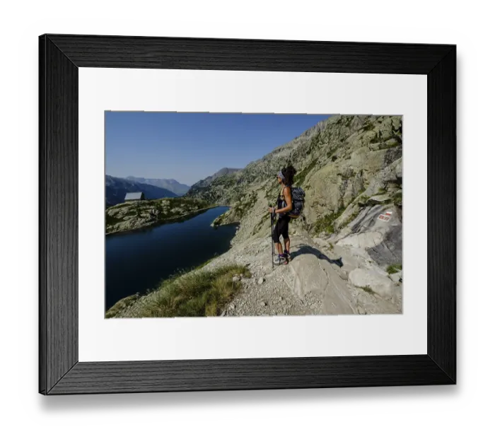 Framed Print : Hiker on Bachimana reservoir, Ibones azules and Bachimana alto route Framed Print : Hiker on Bachimana reservoir, Ibones azules and Bachimana alto route