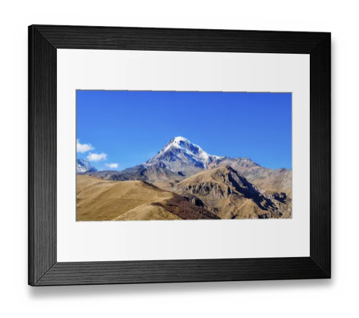 Framed Print : Landscape high rocky mountains of the Caucasus in Georgia on a background of blue sky and clouds
