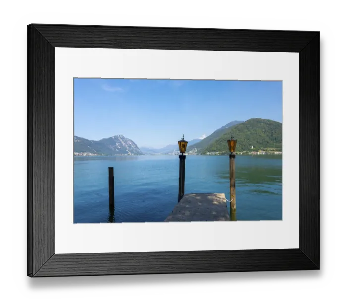 Framed Print : Pier with Lamps on Lake Lugano and Mountain Range in a Sunny Summer Day in Lugano