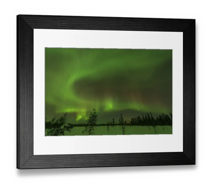 Framed Print : Northern Lights (Aurora borealis) over snowy landscape