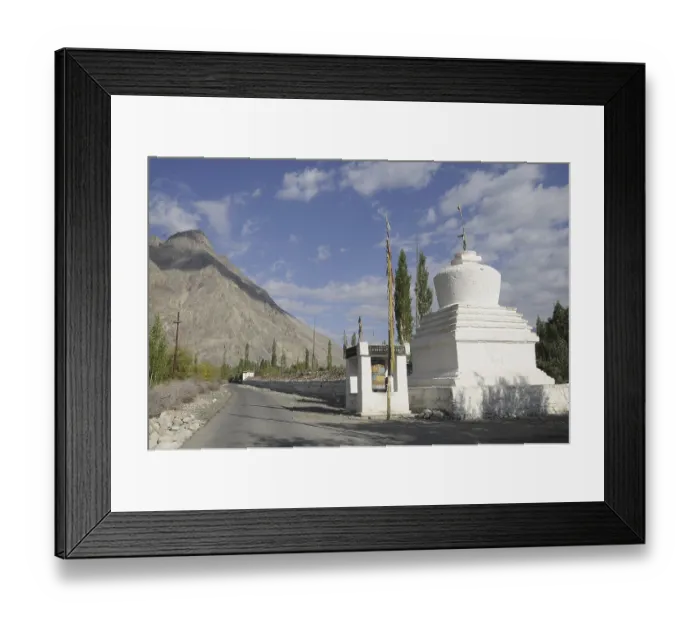 Framed Print : Buddhist chorten with a very long Mani wall beside the road in the Hundar oasis Framed Print : Buddhist chorten with a very long Mani wall beside the road in the Hundar oasis