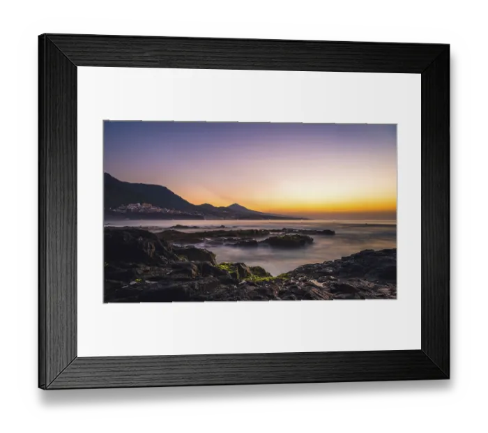 Framed Print : Rocky coast and sea at sunset, behind Bajamar and volcano Pico del Teide Framed Print : Rocky coast and sea at sunset, behind Bajamar and volcano Pico del Teide