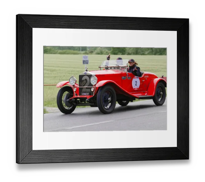 Framed Print : Red classic car with driver and co-driver on a country road during a rally