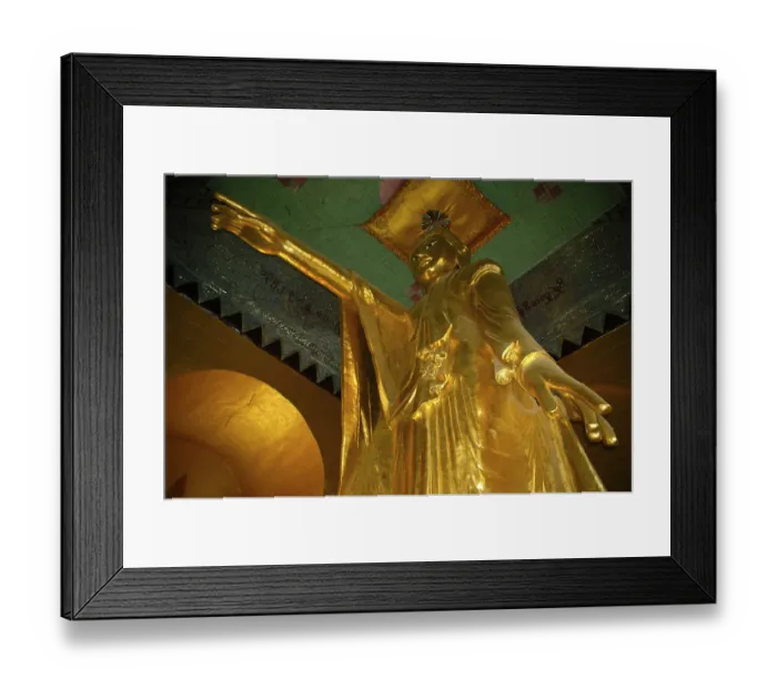 Framed Print : Large standing golden Buddha statue with outstreched arm and pointing finger