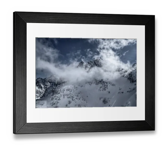 Framed Print : Panoramic view of clouds passing over snowy mountains Framed Print : Panoramic view of clouds passing over snowy mountains