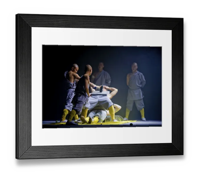 Framed Print : A concrete slab is being smashed on a monk while he is lying on a bed of nails Framed Print : A concrete slab is being smashed on a monk while he is lying on a bed of nails