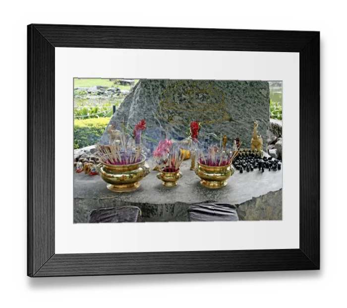Framed Print : Place of worship with incense sticks at the Buddha image on a cliff
