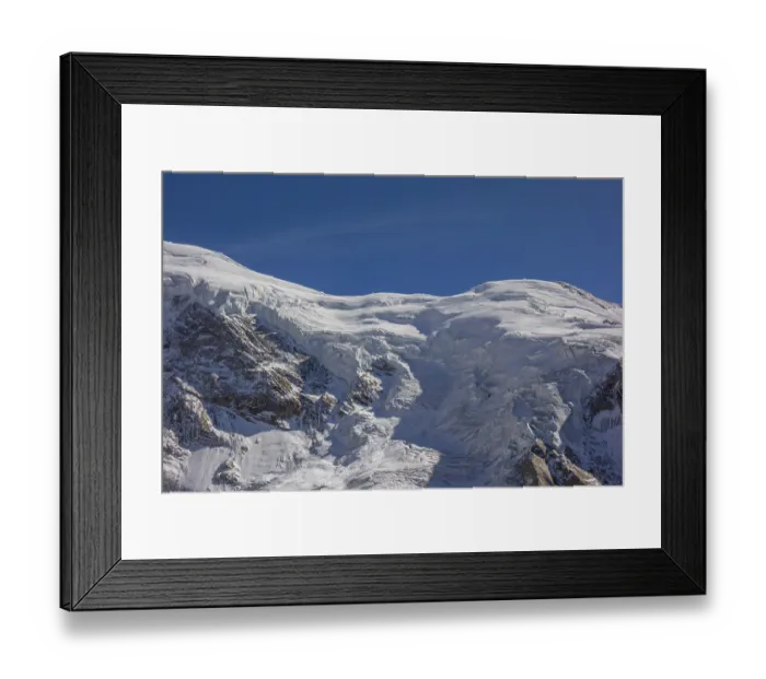 Framed Print : A snow-covered glacier under a blue sky