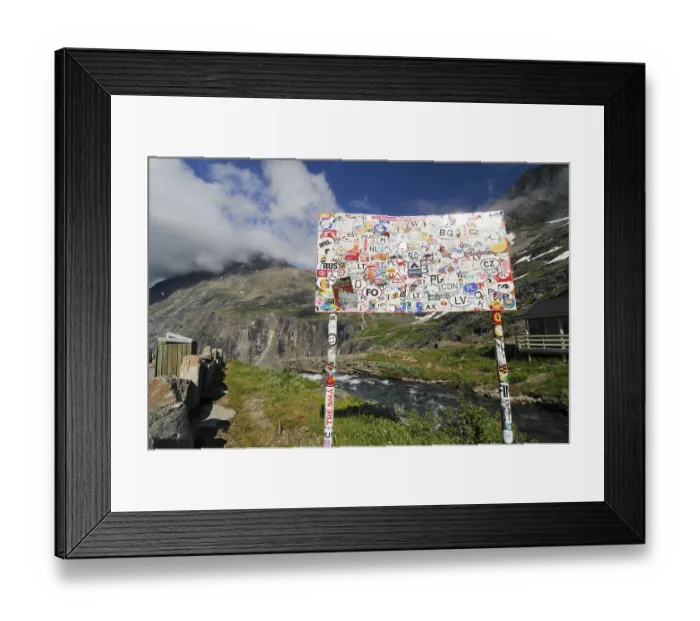 Framed Print : With transfer pictures pasted place-name sign at the Trollstigen Framed Print : With transfer pictures pasted place-name sign at the Trollstigen