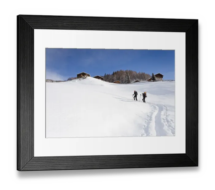 Framed Print : Snowshoe hikers climbing the Morgenrast summit from Unterreinswald
