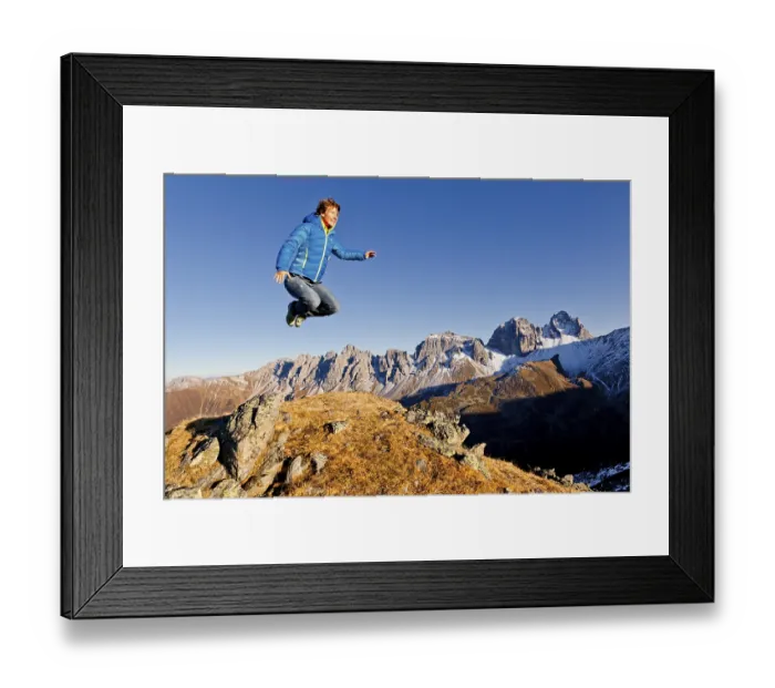 Framed Print : Young woman jumping, Mt Kalkkoegel Framed Print : Young woman jumping, Mt Kalkkoegel
