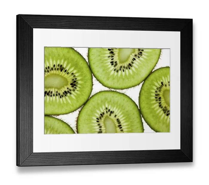 Framed Print : Cut kiwi against a white background Studio shot Framed Print : Cut kiwi against a white background Studio shot