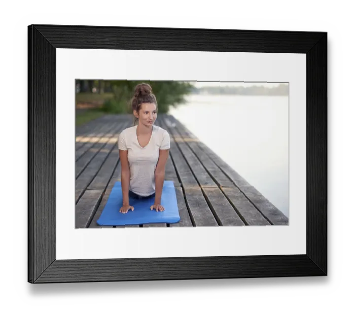 Framed Print : Attractive young woman working out on mat on a wooden deck above a lake or river doing a yoga pose smiling Framed Print : Attractive young woman working out on mat on a wooden deck above a lake or river doing a yoga pose smiling