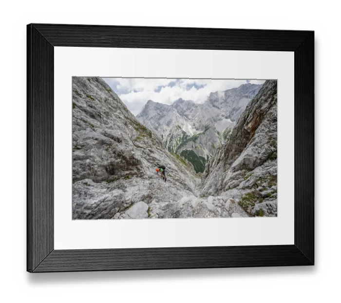 Framed Print : Mountaineer climbing in steep rocky terrain on the way to Waxenstein Framed Print : Mountaineer climbing in steep rocky terrain on the way to Waxenstein