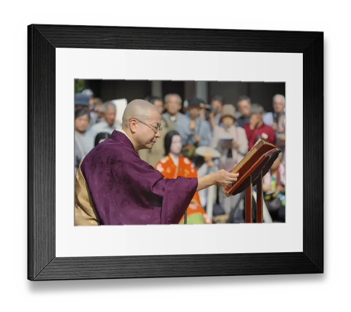 Framed Print : Nun wearing sutras for a Buddhist memorial service