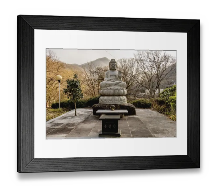 Framed Print : Stone carved sitting Buddha at Buddhist temple