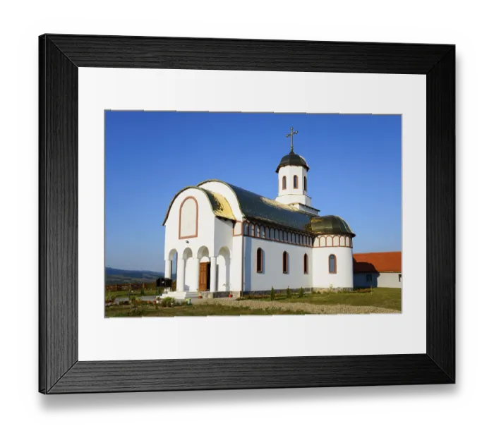 Framed Print : A small church with a white and gold facade under a blue sky looks peaceful and inviting