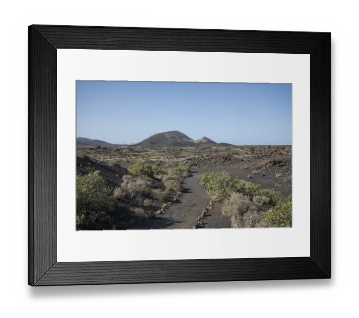 Framed Print : View of mountain range with volcanoes in Timanfaya National Park