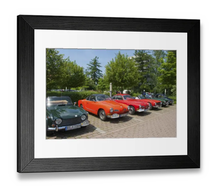 Framed Print : A row of various vintage cars, green and red
