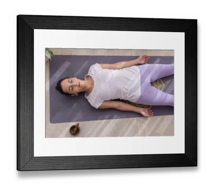 Framed Print : Young woman in a yoga studio relaxing in Shavasana pose Framed Print : Young woman in a yoga studio relaxing in Shavasana pose
