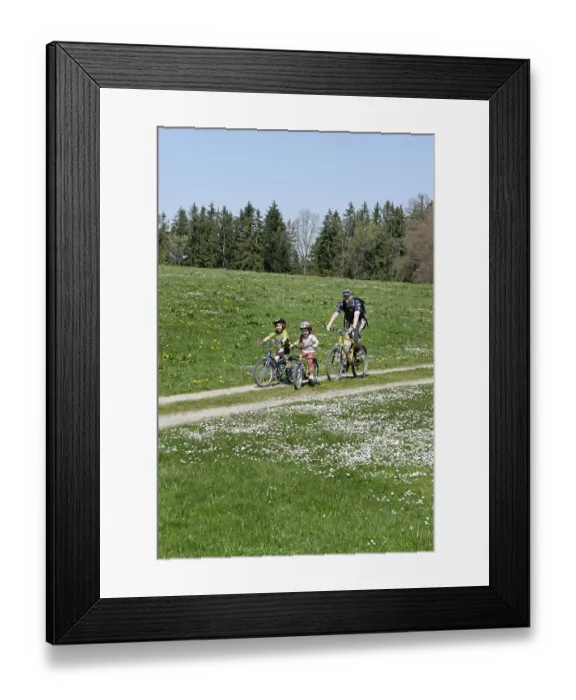 Framed Print : Family on a bicycle ride near Koenigsdorf