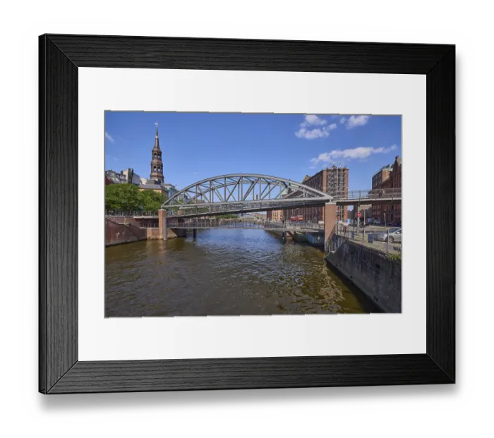Framed Print : Kibbelsteg Bridge over the Zollkanal and the main church of St Katharinen