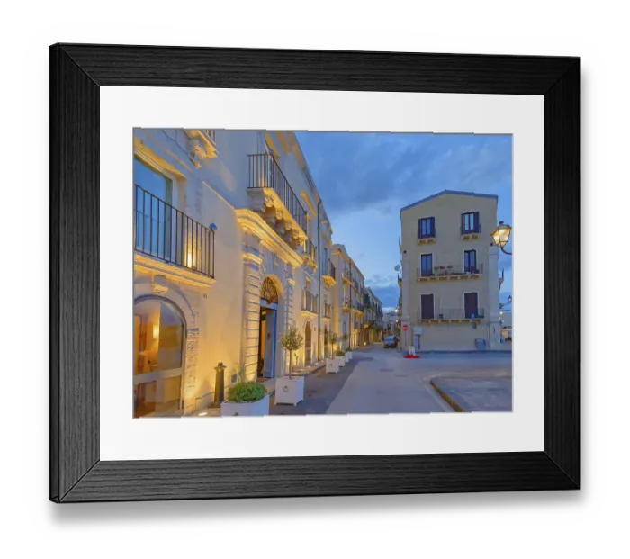 Framed Print : Historic district traditional buildings illuminated at dusk