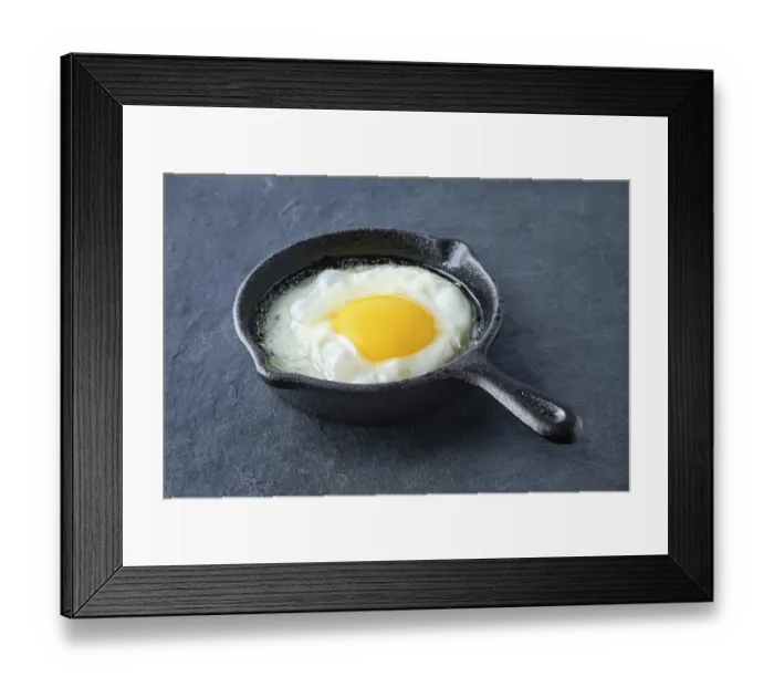 Framed Print : Scrambled egg in small cast-iron skillet