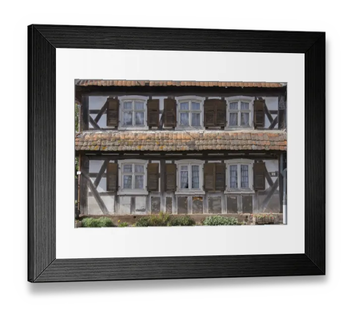 Framed Print : Half-timbered house, dilapidated facade with windows Framed Print : Half-timbered house, dilapidated facade with windows