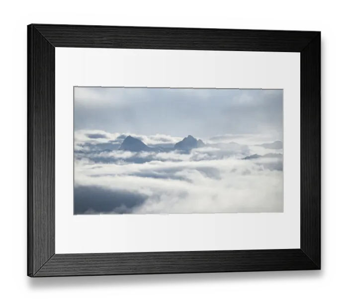 Framed Print : View of mountains between clouds