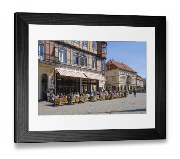 Framed Print : Tourists sitting outside a restaurant on the market square Framed Print : Tourists sitting outside a restaurant on the market square