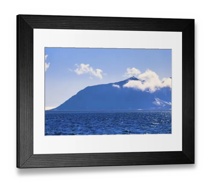 Framed Print : View at a mountain with clouds at Svalbard coast