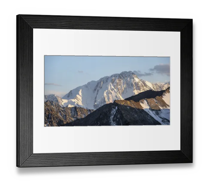 Framed Print : High mountain peaks with glaciers at sunset