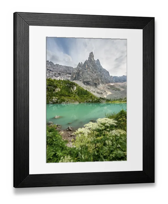 Framed Print : Turquoise-green Sorapis lake with flowers