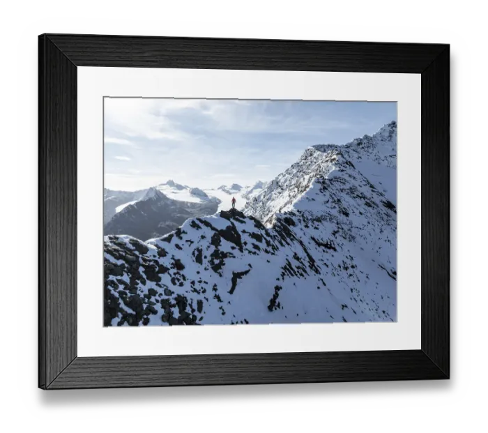 Framed Print : Mountaineer standing on the snow-covered Ramoljoch under a clear sky in the Alps Framed Print : Mountaineer standing on the snow-covered Ramoljoch under a clear sky in the Alps