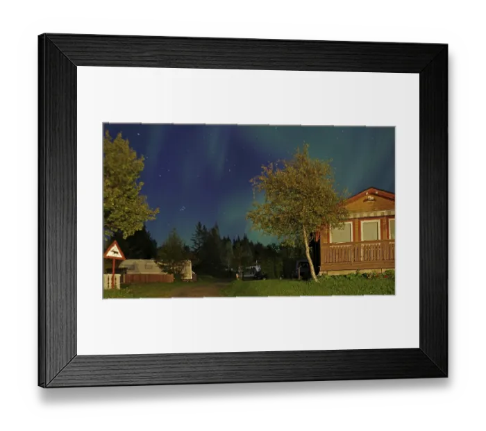 Framed Print : Northern lights (aurora borealis) over holiday homes Framed Print : Northern lights (aurora borealis) over holiday homes