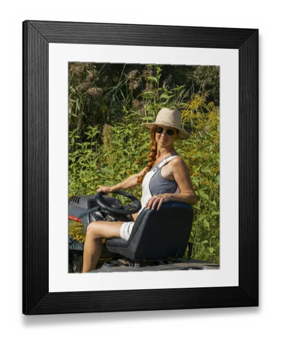 Framed Print : Woman driving lawn mower, lawn tractor