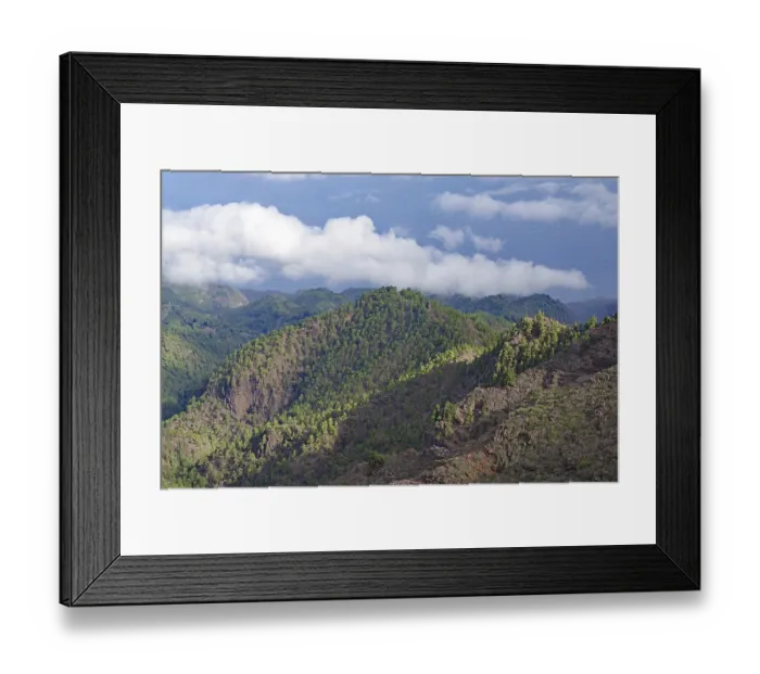 Framed Print : Wooded mountain landscape with clouds in the sky and view of the sea Framed Print : Wooded mountain landscape with clouds in the sky and view of the sea