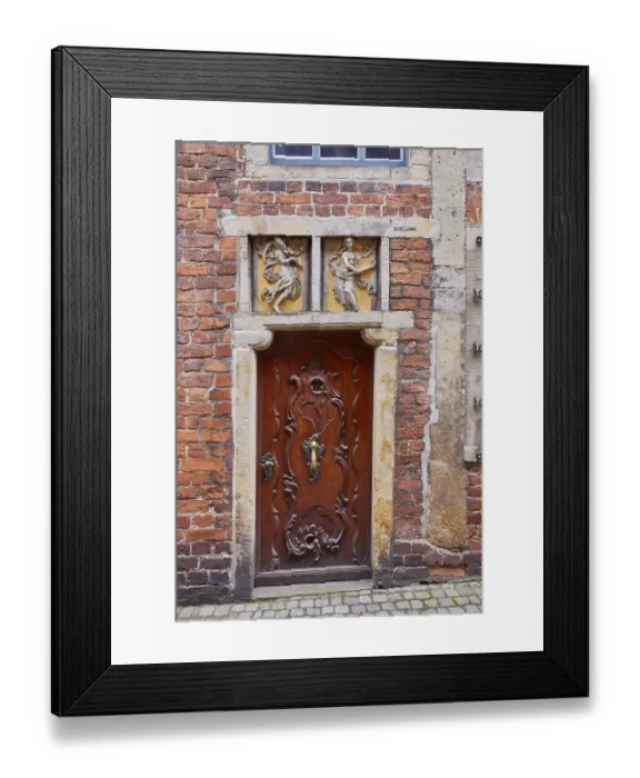 Framed Print : Relief in the lintel and old wooden door of a house in Boettcherstrasse in Bremen