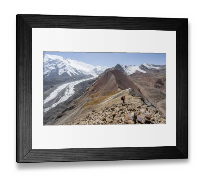Framed Print : Mountaineer at Traveller's Pass with view of impressive mountain landscape
