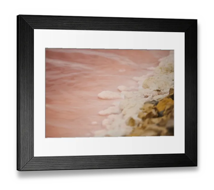 Framed Print : Salt crust at the waters edge of a little salt water pond for industrial salt production
