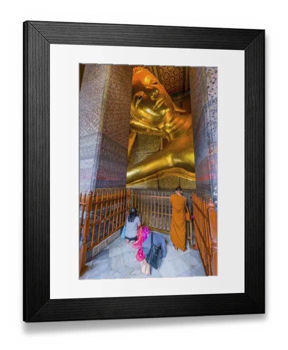 Framed Print : Reclining Buddha with praying monk in Wat Pho temple Framed Print : Reclining Buddha with praying monk in Wat Pho temple