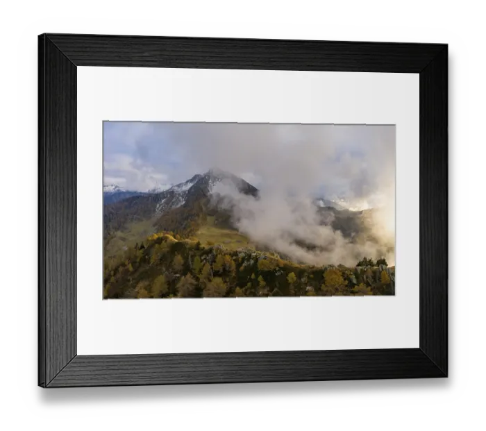 Framed Print : Aerial view of Corno di Gesero with clouds and autumn forest in the foreground