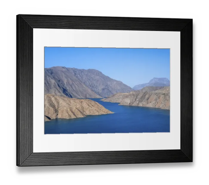 Framed Print : Blue Toktogul reservoir between dry mountain landscape Framed Print : Blue Toktogul reservoir between dry mountain landscape