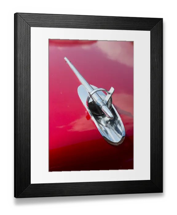 Framed Print : A shiny chrome radiator grille on the bonnet of a red classic car Framed Print : A shiny chrome radiator grille on the bonnet of a red classic car