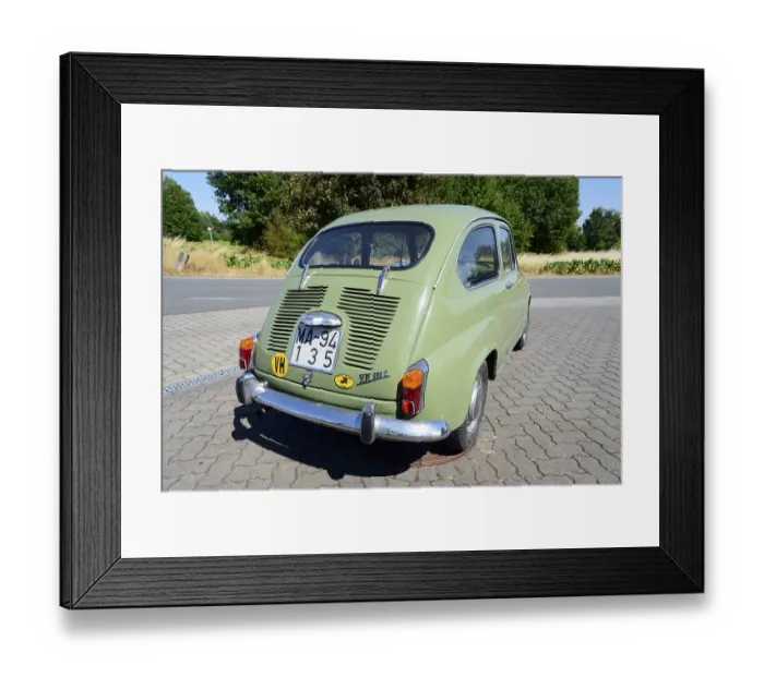 Framed Print : Olive green classic car parked in daylight