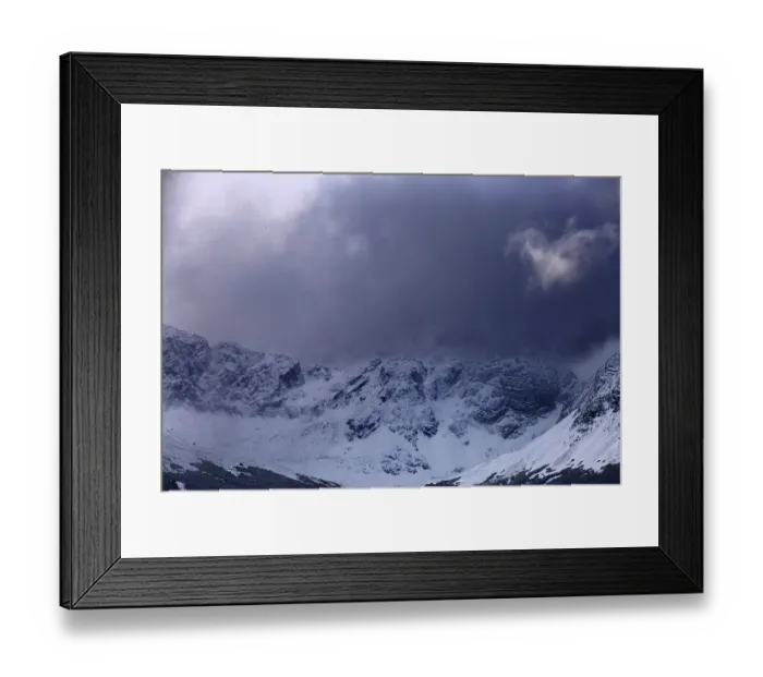 Framed Print : Shady mountains with snow under dark